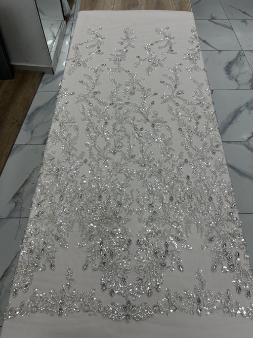 Silver sequin fabric on a white surface