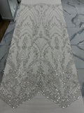 Silver sequin fabric on a flat surface