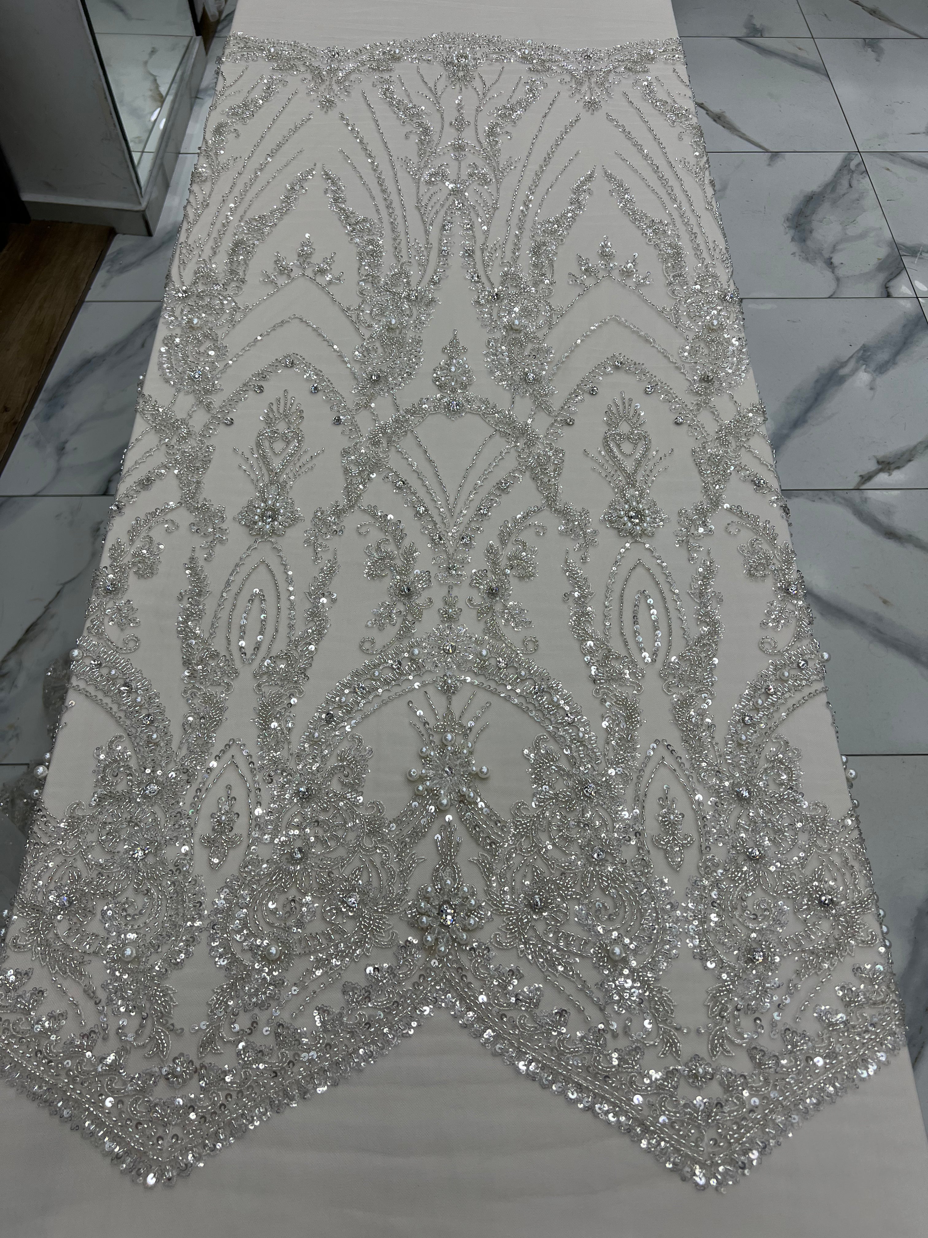Silver sequin fabric on a flat surface