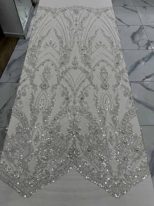 Silver sequin fabric on a flat surface