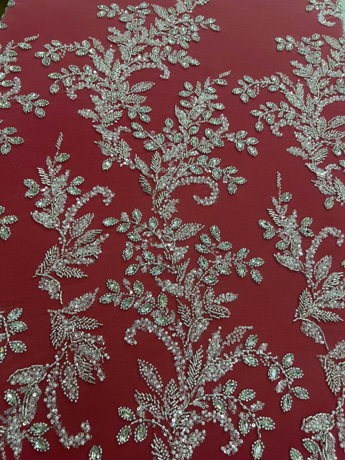 Embroidered lace with scattered floral motifs and shimmering beads